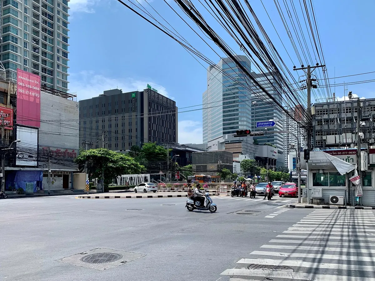 The Huai Khwang intersection on Ratchadaphisek Road with hotel and office towers — the MRT catalyst tier of the Bangkok condo market