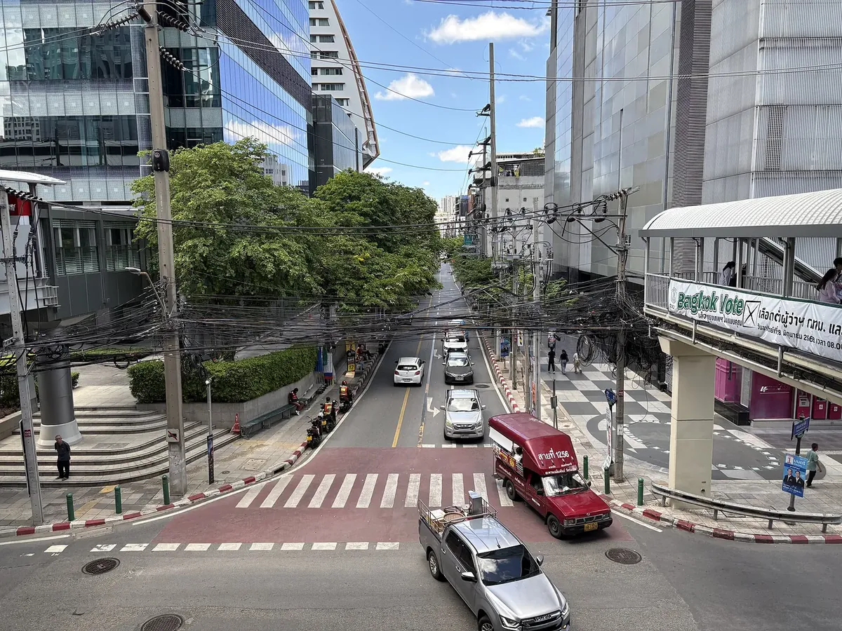 Office towers and a skywalk over Soi Sathon 11 — the mature office-anchored CBD tier of the Bangkok condo market
