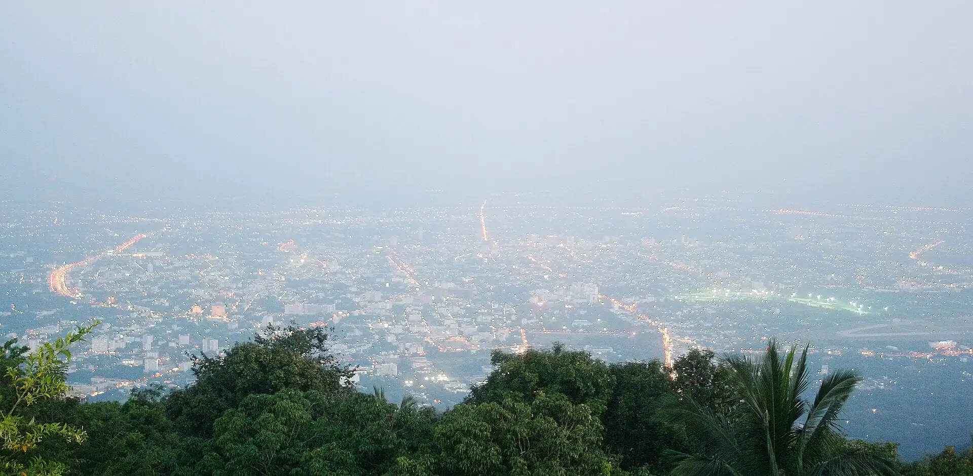 Chiang Mai at sunset. The same skyline reads differently to an investor and a tourist