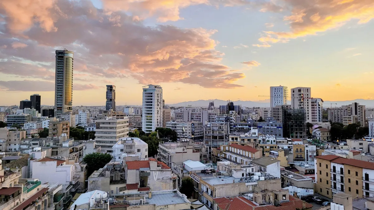 Nicosia skyline at sunset: Cap. 109 decides which foreign buyers need permission