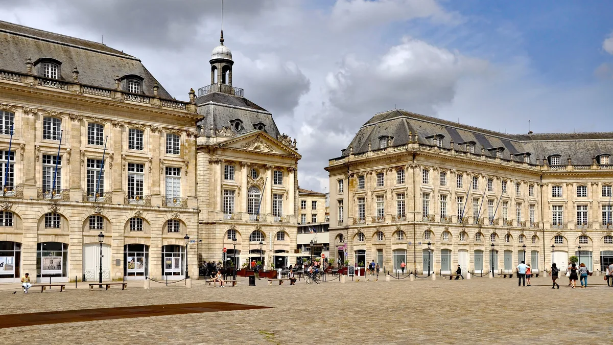 Eighteenth-century facades on Bordeaux's Place de la Bourse, for the taxes a foreign owner pays in France