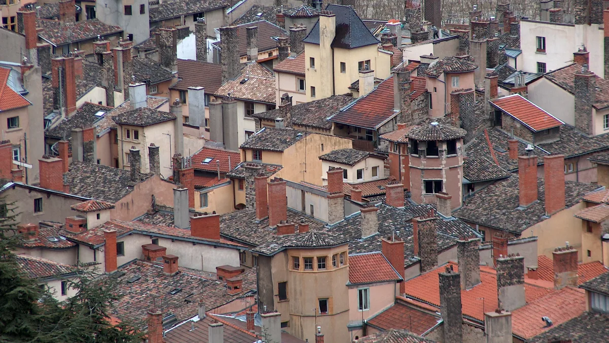 Rooftops of Vieux Lyon, a rent-controlled city, for sourced French rental yield figures