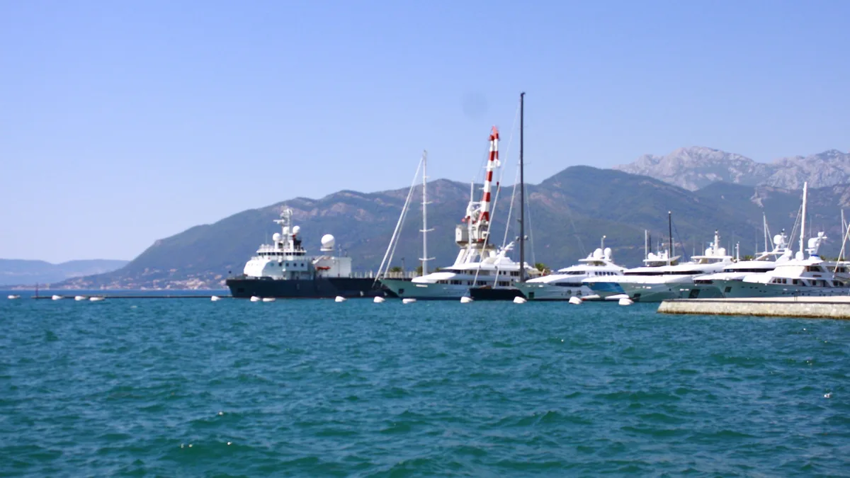 Tivat marina and the mountains behind: annual real estate tax is set by each municipality
