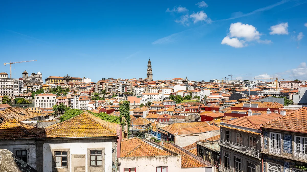 Porto's residential rooftops and the Clérigos tower, a city with no nationality test on buying homes