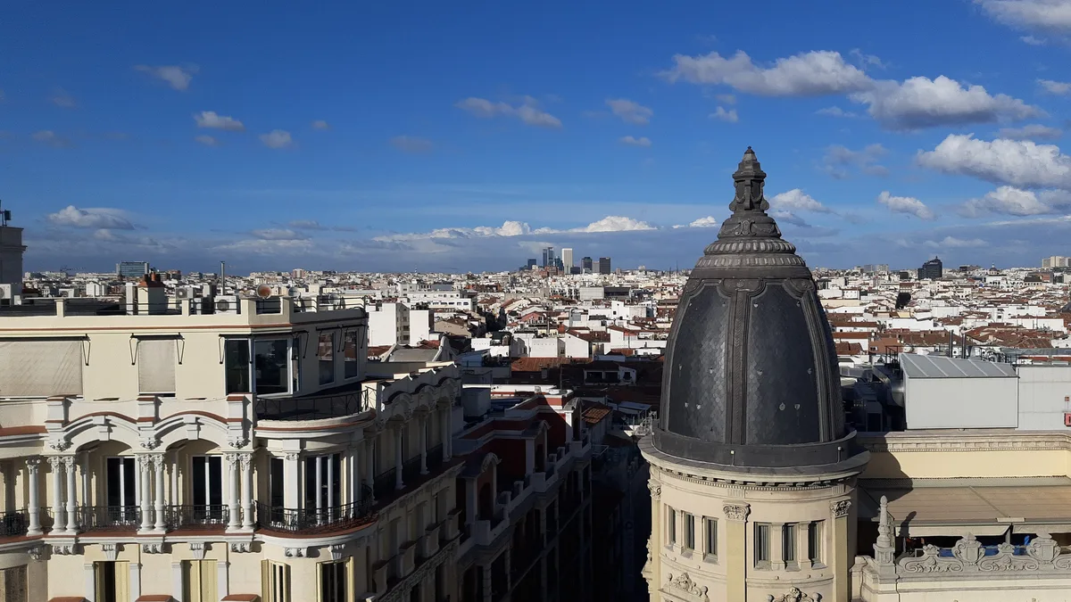 Apartment blocks and rooftops of central Madrid, where non-resident owners pay IBI and non-resident income tax