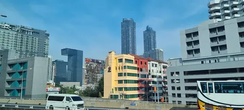 The Rama 9 skyline with G Tower's cantilever profile — the office-anchored tenant engine of the Ratchada corridor