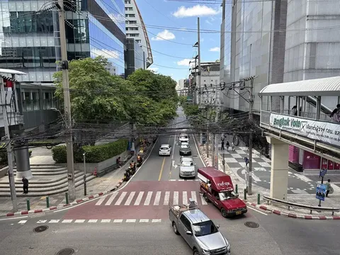 Office towers and a skywalk over Soi Sathon 11 — the mature office-anchored CBD tier of the Bangkok condo market
