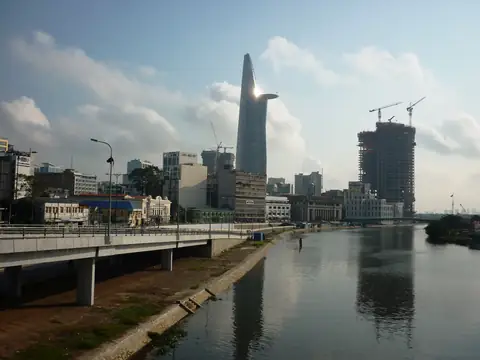 A Vietnamese skyline mid-build — what off-plan marketing prices in and leaves out