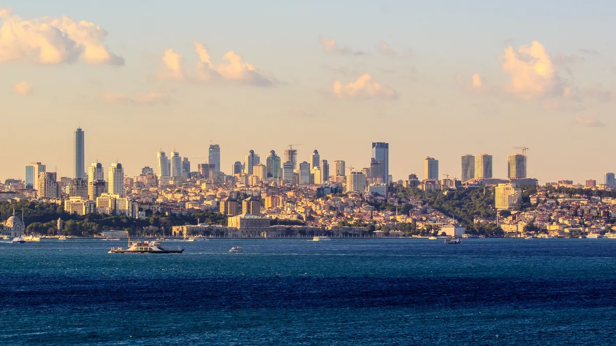 Istanbul skyline at sunset: a 2% deed fee, the service fee and compulsory earthquake insurance